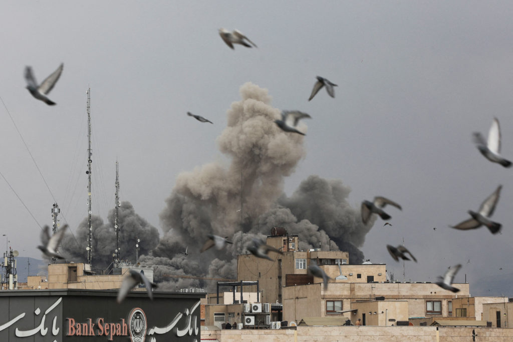 "Birds fly as smoke rises following an explosion, after Israel and the U.S. launched strikes on Iran, amid the U.S.-Israel conflict with Iran, in Tehran, Iran, March 2, 2026." -description by Reuters